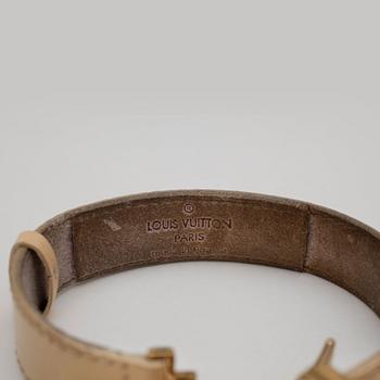 LOUIS VUITTON, a beige leather bracelet.