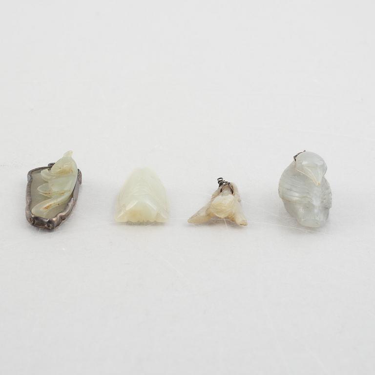 A group of eight Chinese stone charms / pendants, 20th century.