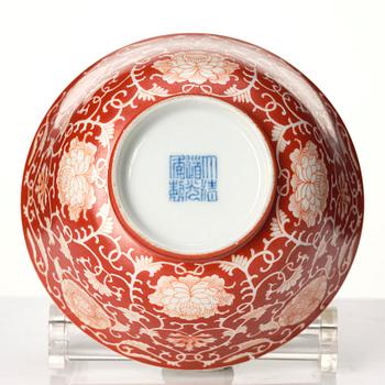 A coral red reverse decorated lotus bowl, Qing dynasty with Daoguang mark in underglaze blue.