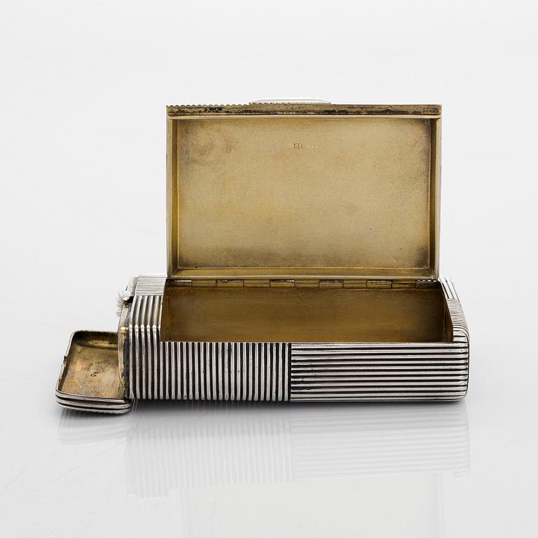 A silver cigarette case with match box and lighter, silver, St. Petersburg, 1882-1899. Unidentified master mark PS.