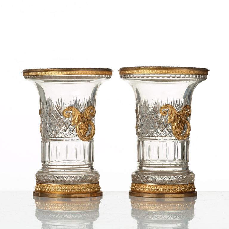 A pair of Empire-style circa 1900 cut glass and gilt-brass urns.