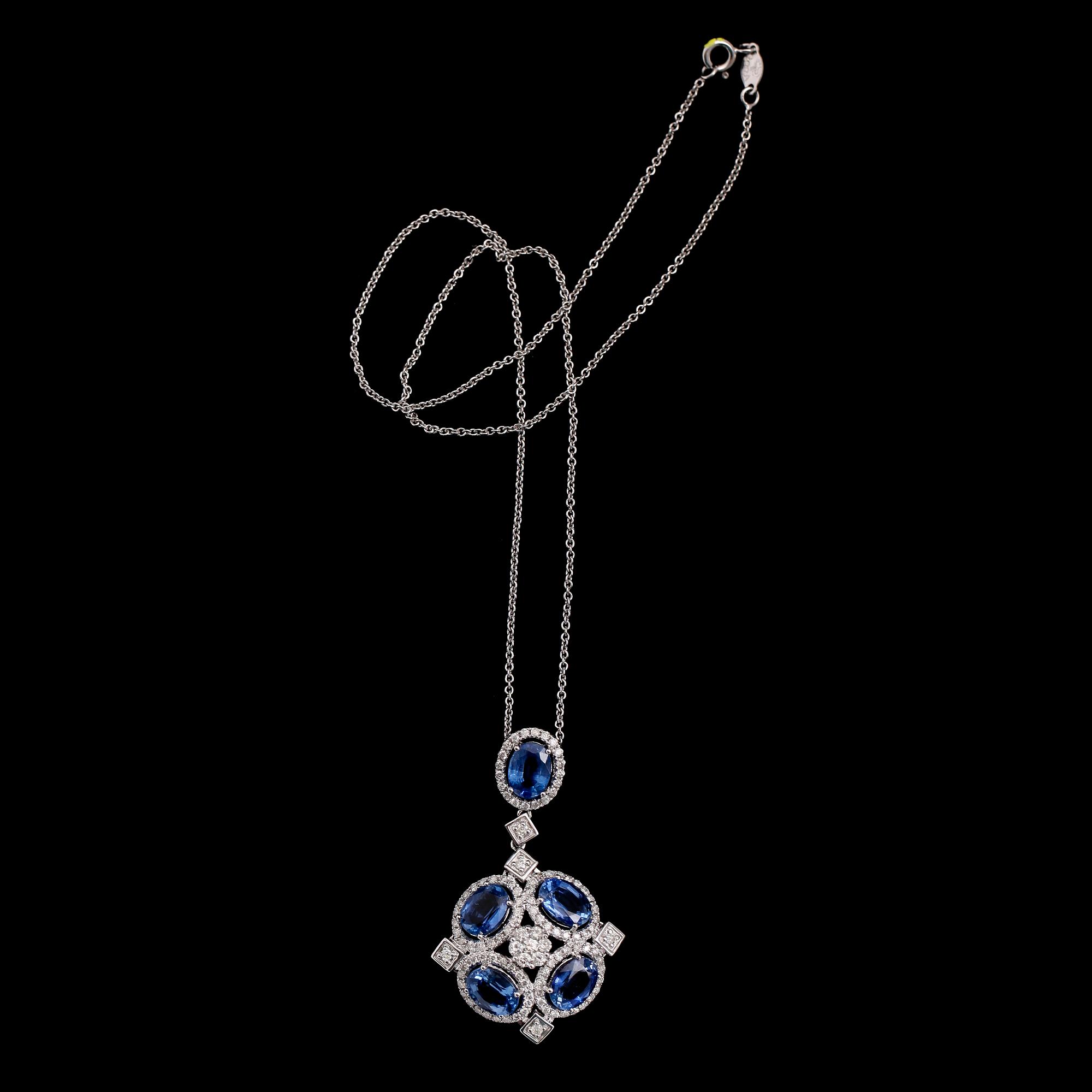 COLLIER, 18 k vitguld, hänge med briljantslipade diamanter totalt 1.14 ct samt blå kyaniter.