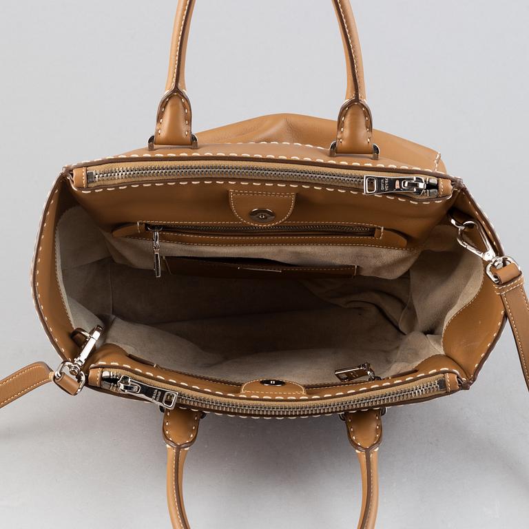 Prada, a leather handbag.