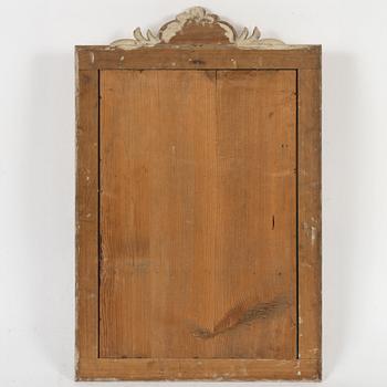 A Gustavian giltwood frame with mirror glass, Stockholm, late 18th century.