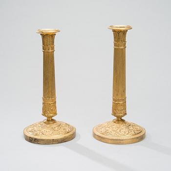 A PAIR OF CANDLESTICKS, gilt bronze, empire early 19th century.