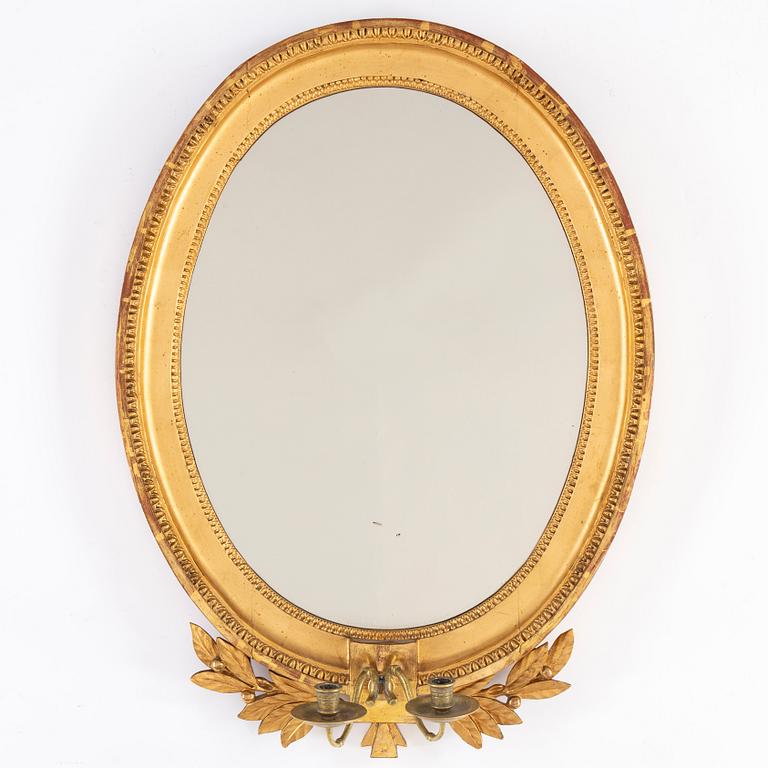A late Gustavian two-light girandole mirror, circa 1800.