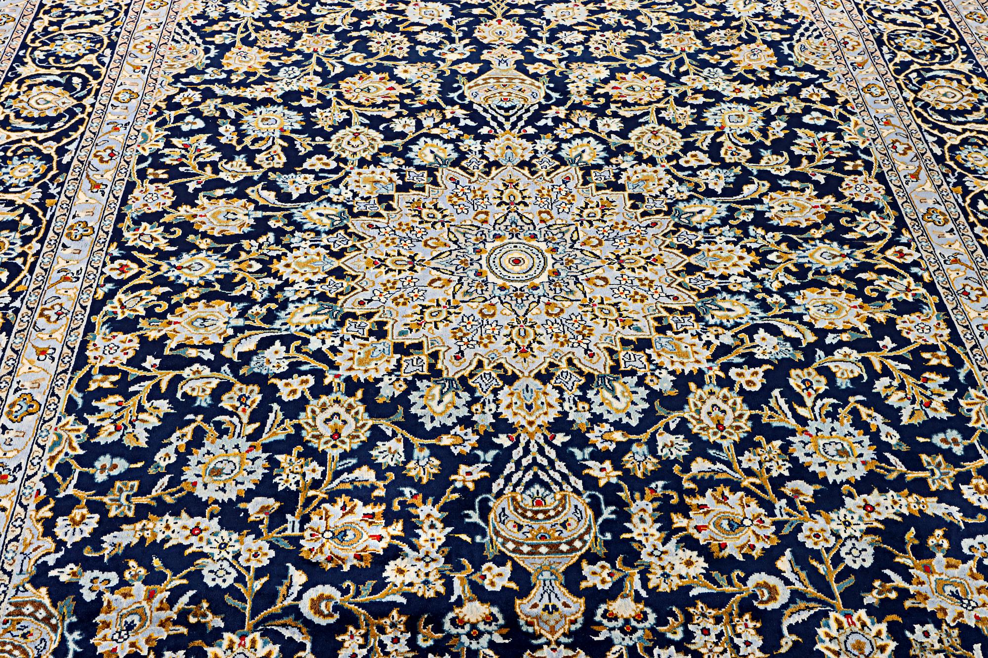 A Kashan carpet, c. 343 x 236 cm.