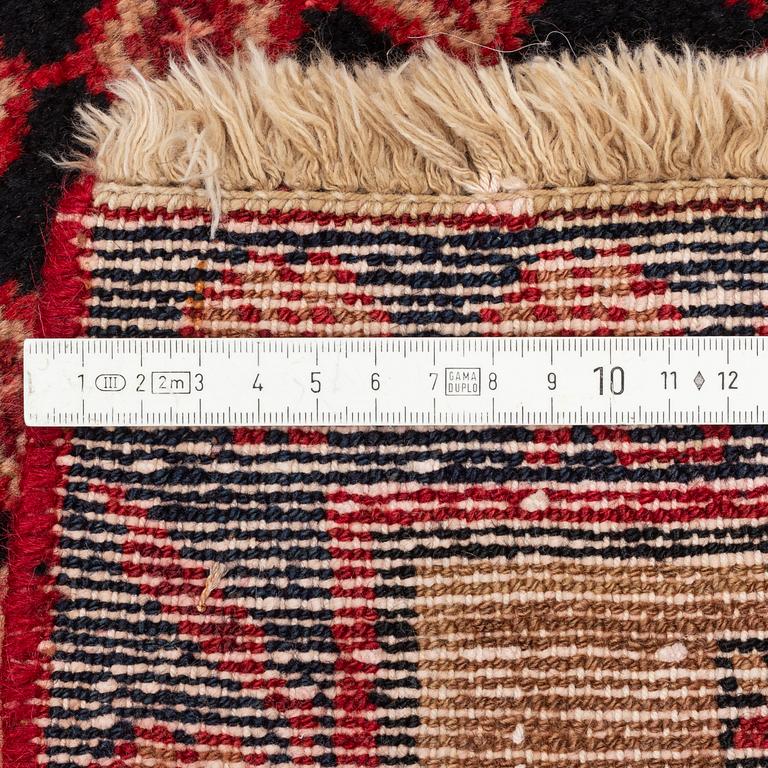 A west persian rug, ca 244 x 141 cm.
