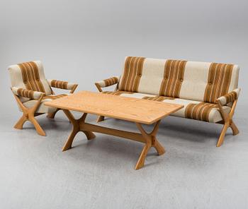 A 1960/70's pine sofa, armchair and coffee table.