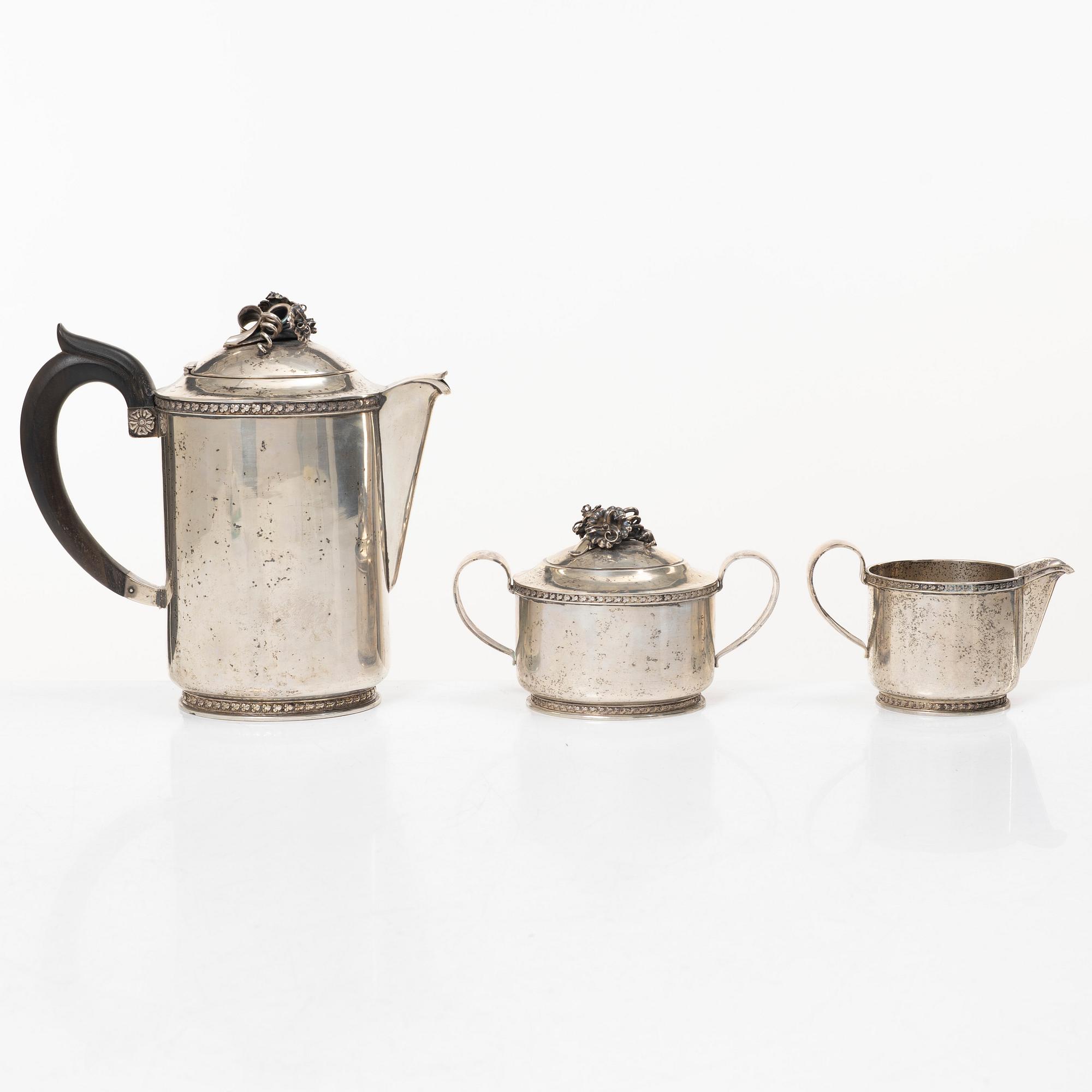 A Swedish silver coffee pot, cream jug and sugar bowl, mark of Caneman & Wallen, Stockholm 1949.