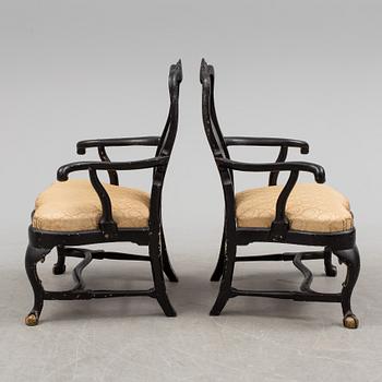 A pair of 18th century armchairs.