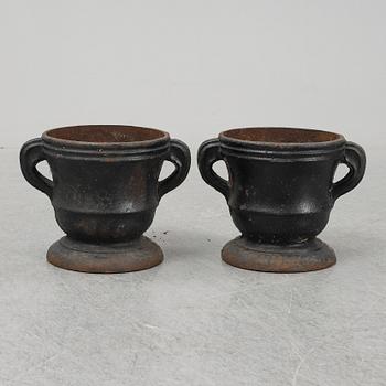 A 19th  century pair of cast iron flower pots.