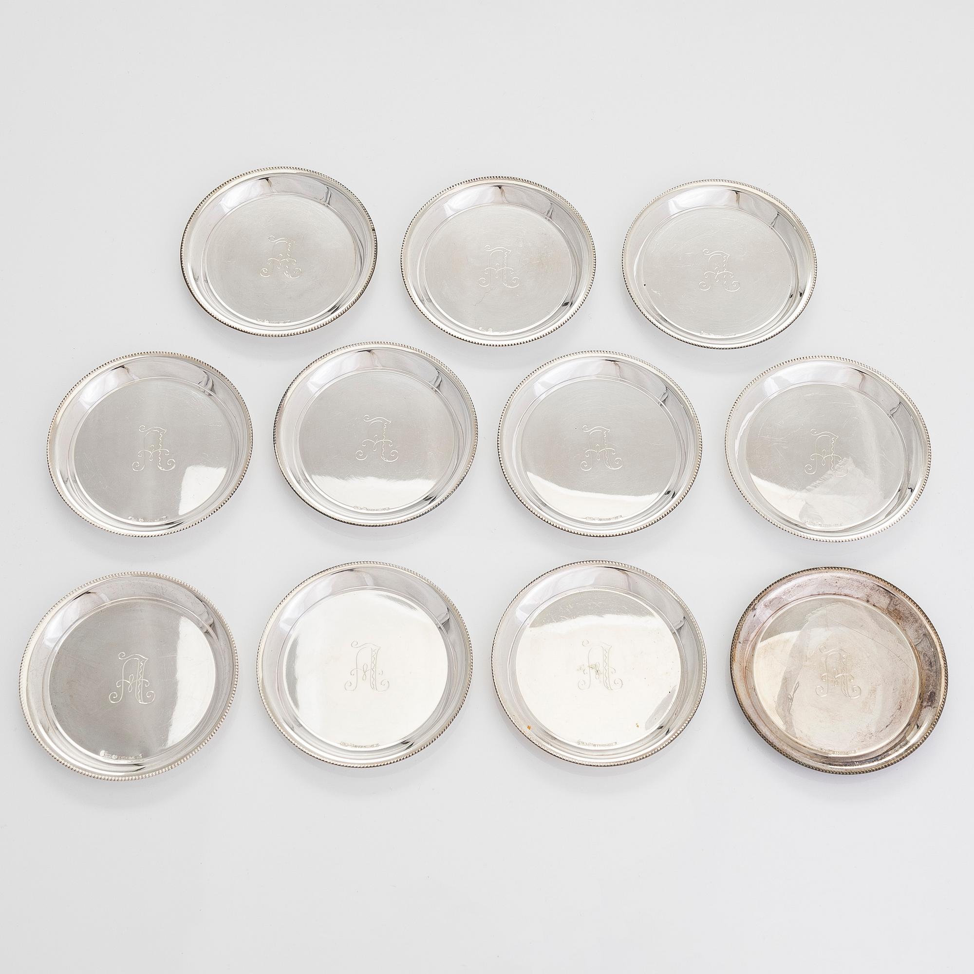 A 21-piece set of 'Chippendale' silver cutlery, and 11 silver coaster, Turku and Hämeenlinna, 1983-90 and 1964.