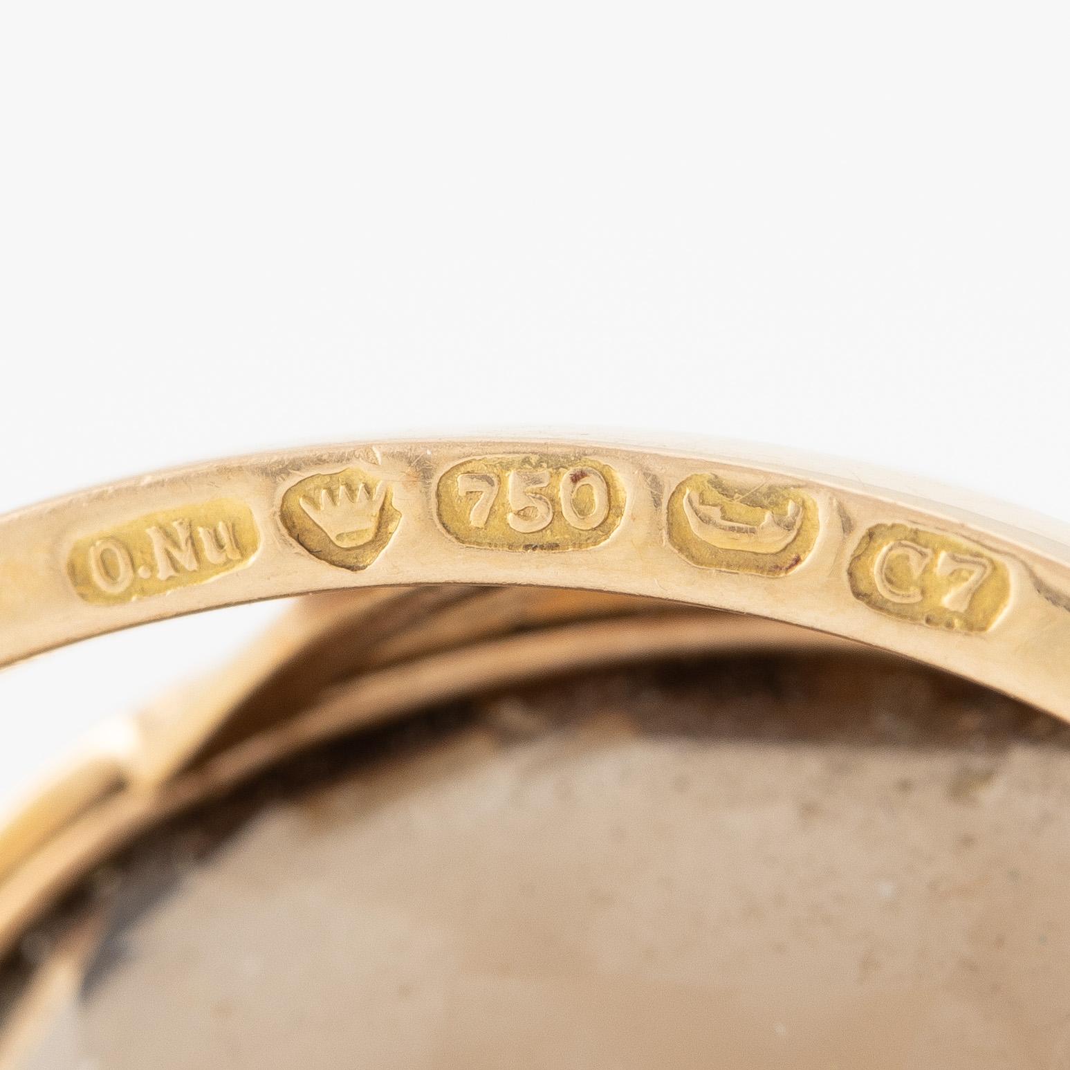 Brosch 18K guld med en fasettslipad rökkvarts.