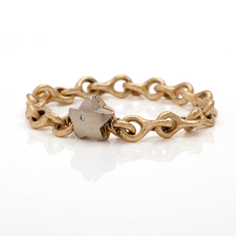 Armband 18K guld med en diamant.