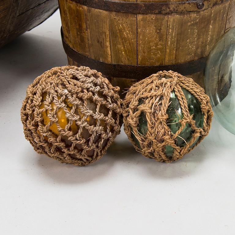 A wooden scoop and bucket and three glass spheres, 18th and 19th Century.