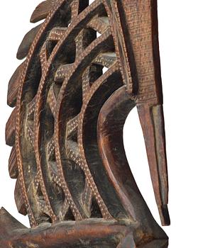 A SCULPTURE, a headdress, Tshiwara/Ciwara (stylized male antelope), wood, the Bambara tribe, Mali, h. 94 cm. On a base.