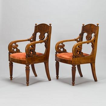 A pair of Baltic open armchairs from around 1820.