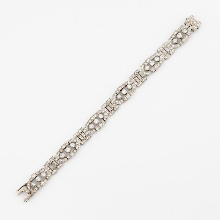 A platinum bracelet with round brilliant-and eight-cut diamonds.