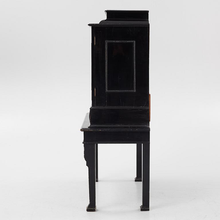 A South-German Baroque ebonized collector's cabinet on stand, circa 1700.