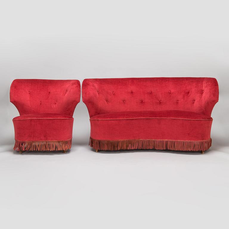 A mid-20th -century sofa and armchair.