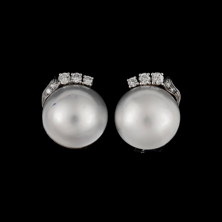 A pair of cultured half pearl and diamond, total circa 0.90 ct, earrings.