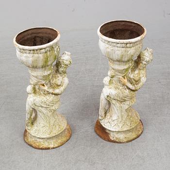 An end of the 20th Century pair of cast  iron flower pots.