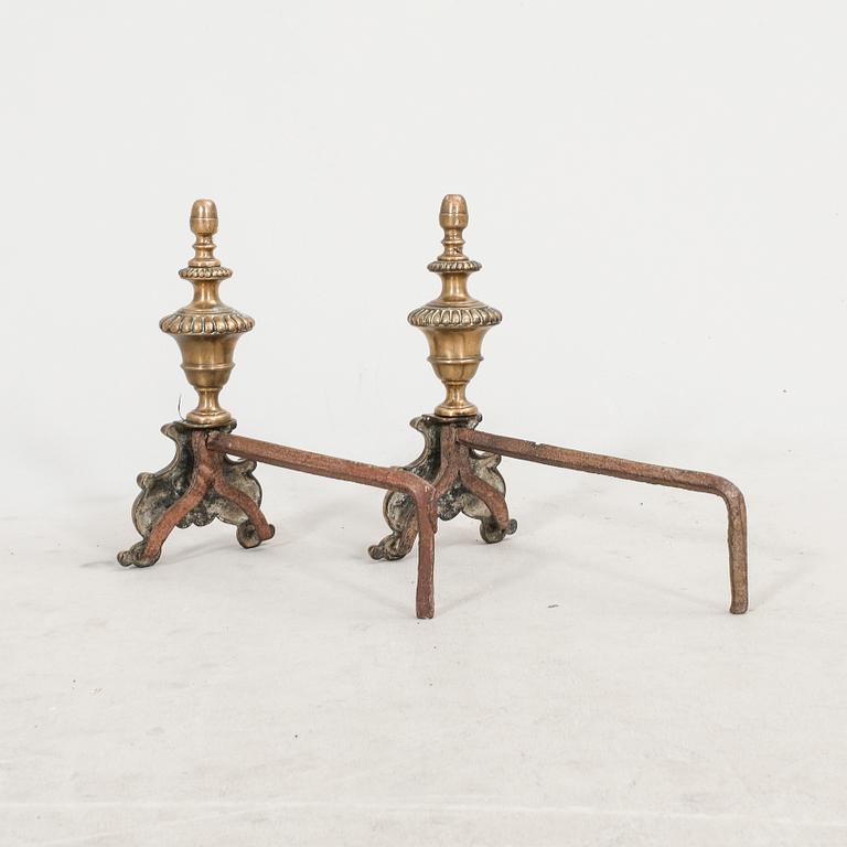 A pair of French metal chenets later part of the 19th century.