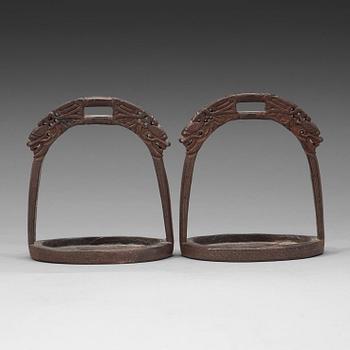 82. A pair of bronze stirrups, Qing dynasty, 19th Century.