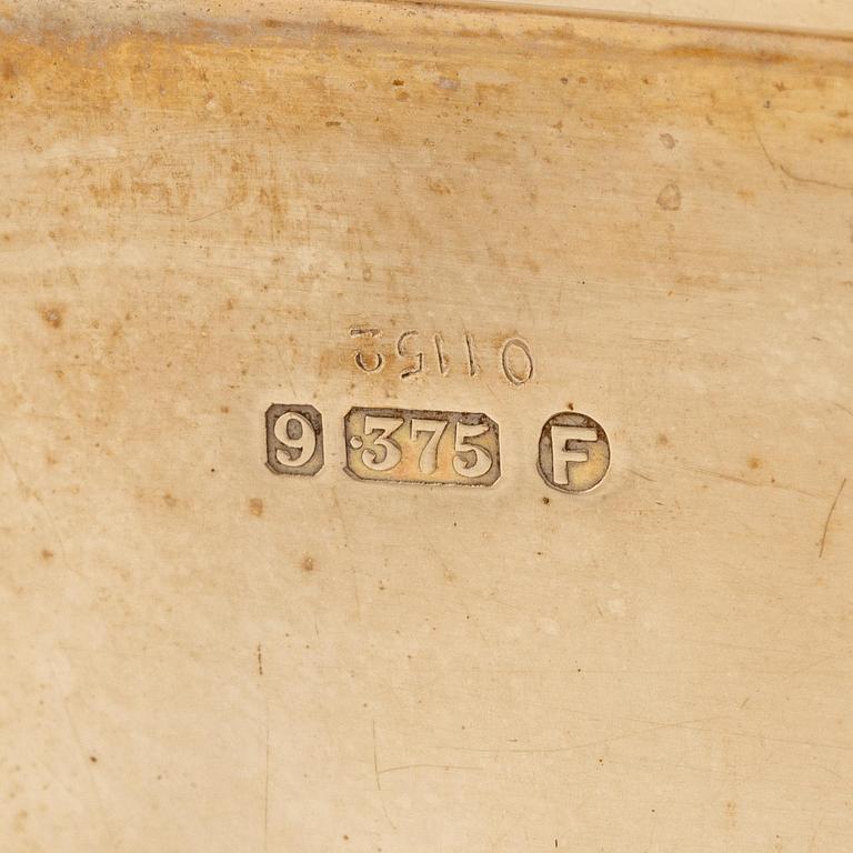 A Cartier 9 carat gold and calibré-cut sapphires cigarette case, London.