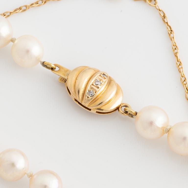 Collier odlade pärlor lås 14K guld med diamanter.