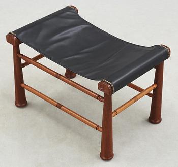 A Josef Frank mahogany and black leather stool, Svenskt Tenn, model 972.
