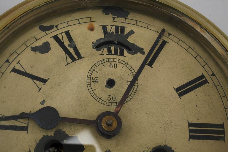 A 20th century ship clock and a barometer.