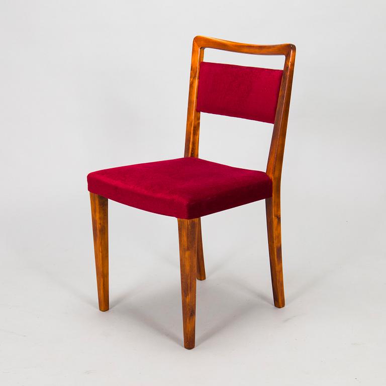 A mid 20th century dining table and a set of four chairs, Oy Boman Ab and two chairs Werner West.