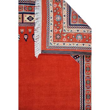 A Persian carpet, approximately 295 x 200 cm.
