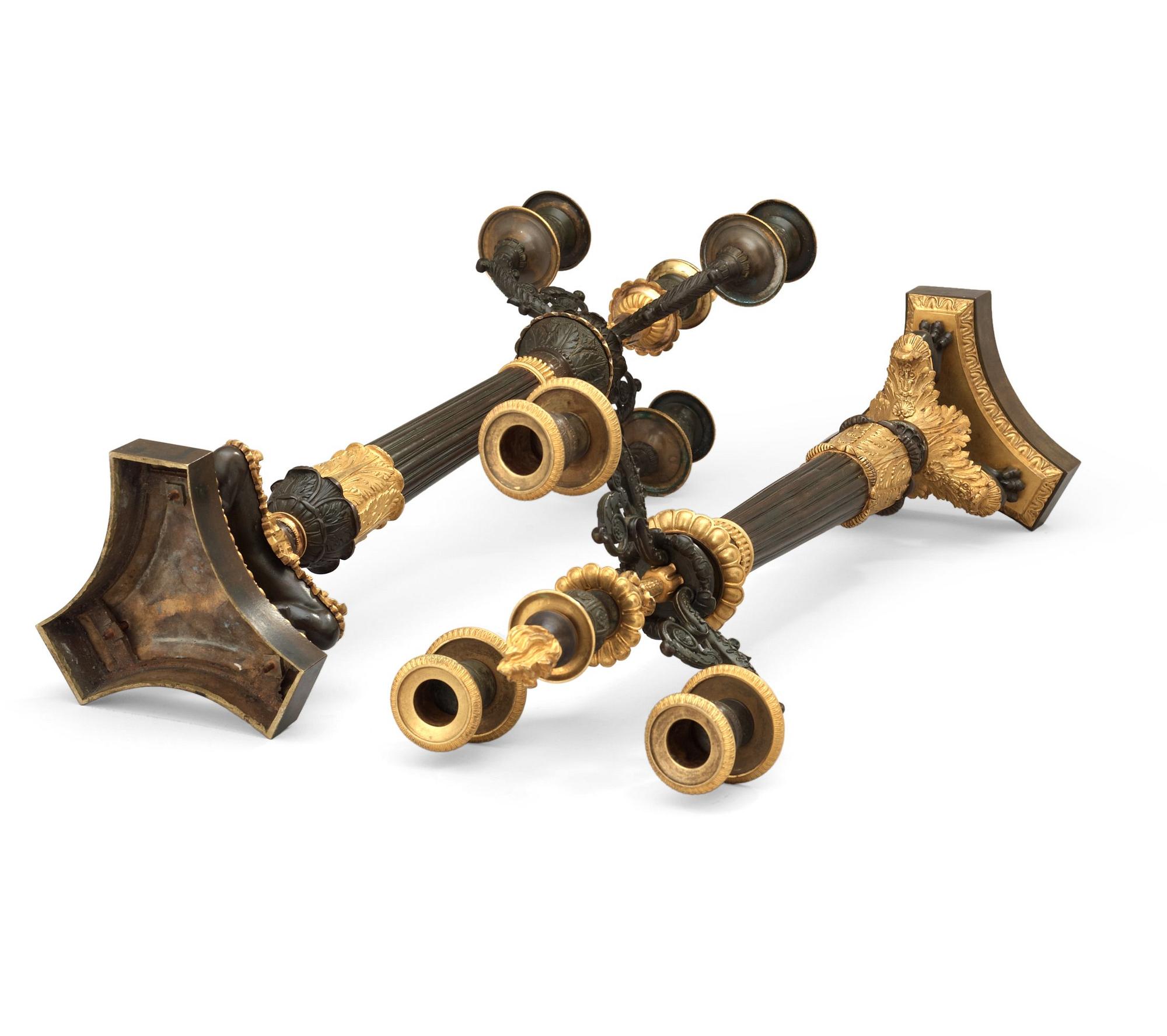 A pair of French Empire 19th century four-light candelabra.