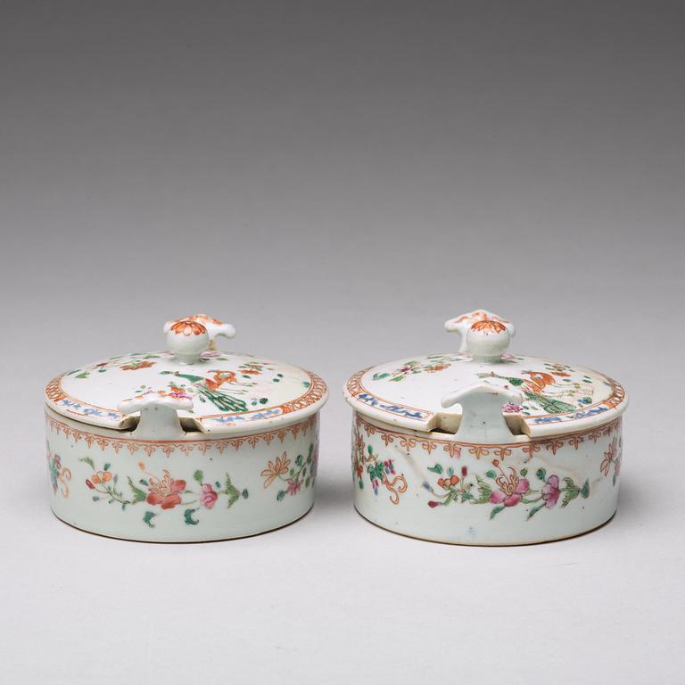 A pair of famille rose 'double peacock' condiment dishes, Qing dynasty, Qianlong (1736-95).