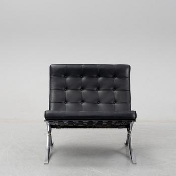 LUDWIG MIES VAN DER ROHE, a 'Barcelona' black leather lounge chair, Knoll Studio.