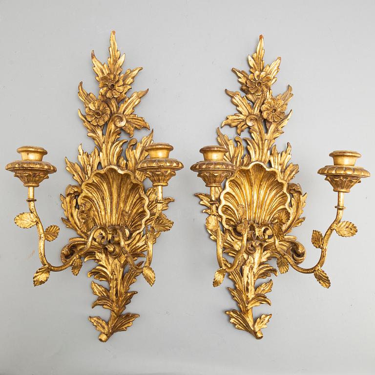 A pair of 20th century Rococo style wall lights.