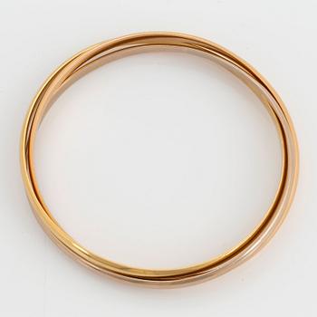 A Cartier "Trinity" bangle.