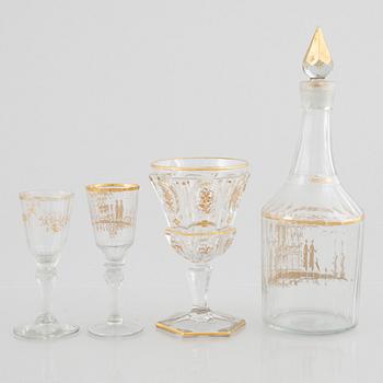 Two sets of wine glasses and a decanter with stopper, later part of the 18th century and later part of the 19th century.