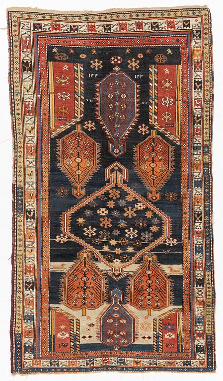 A Caucasian, antique rug, c. 225 x 125 cm.