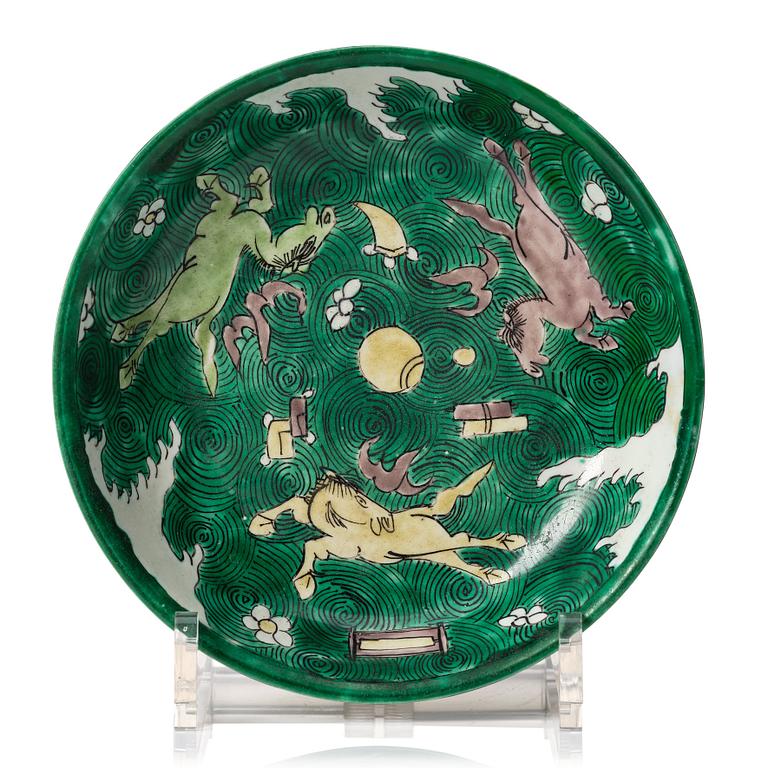 A green yellow and aubergine glazed dish with flying horses, Qing dynasty, Kangxi (1662-1722).