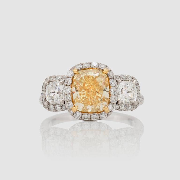 A fancy yellow cushion-cut diamond, 2.57 cts, FY/VS2, ring.