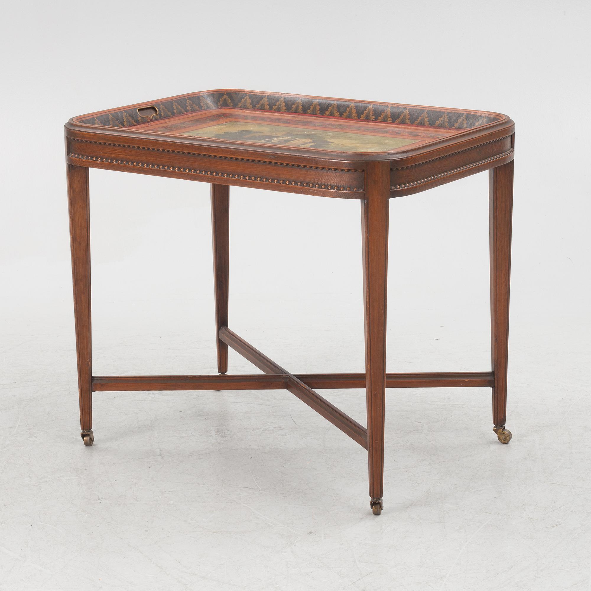 A painted tin tray 19th century with later stand.