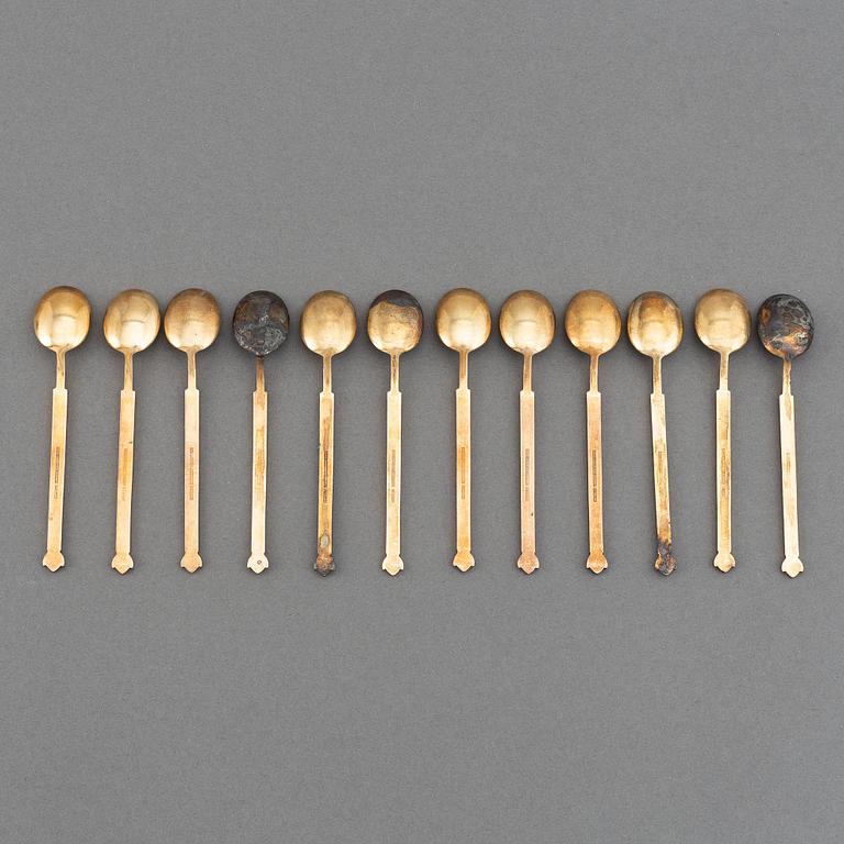 A mixed lot of 35 silver spoons, a tea strainer and two small dishes, parcel-gilt guilloché enamel, Norway, 20th century.