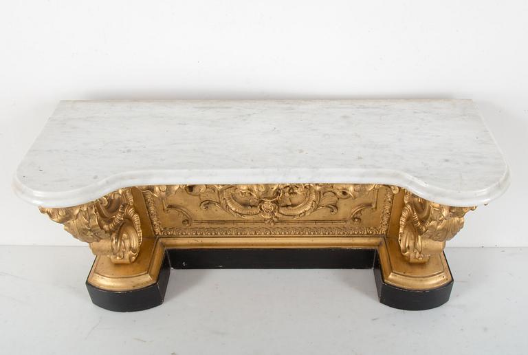 A late 19th century console table with a marble top.