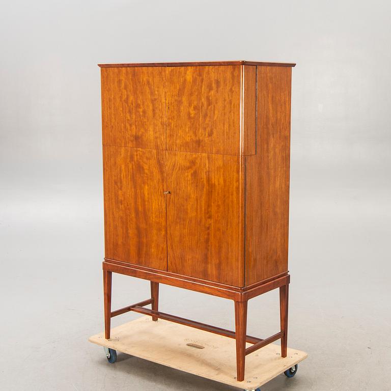 A Swedish Modern 1950s mahogany bar cabinet.