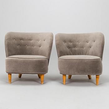 A pair of mid 20th century armchairs.