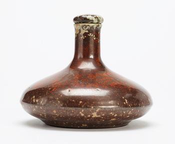 A Hans Hedberg faience bottle with stopper.